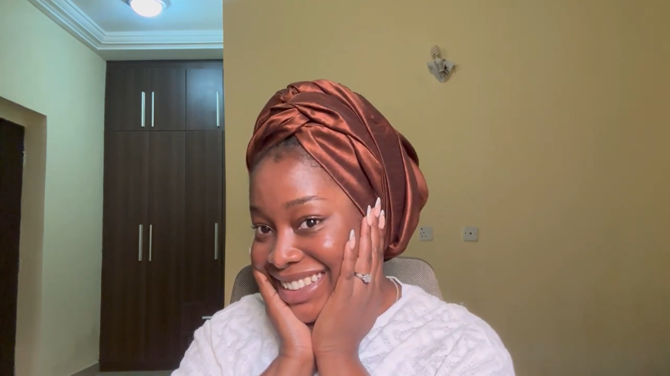 Treasure wearing a copper satin headwrap