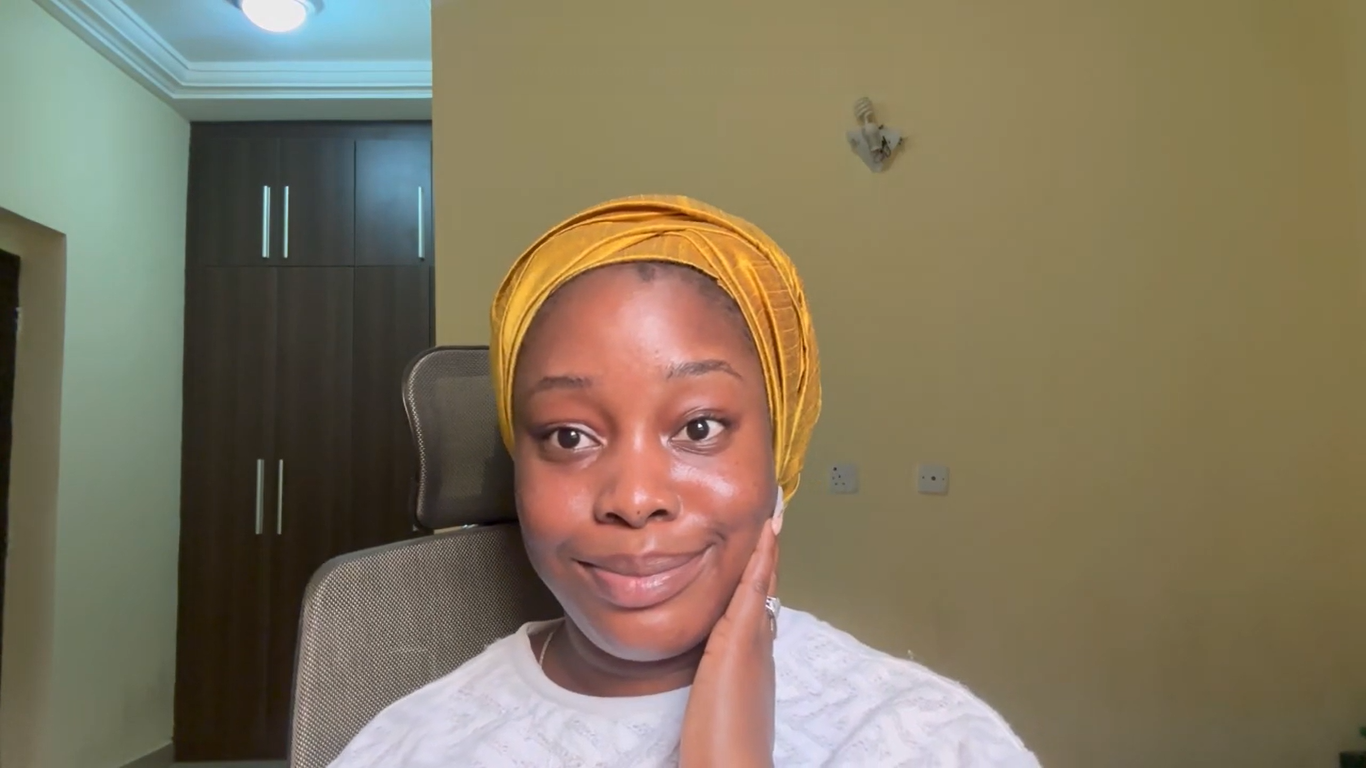 Treasure wearing a gold headwrap