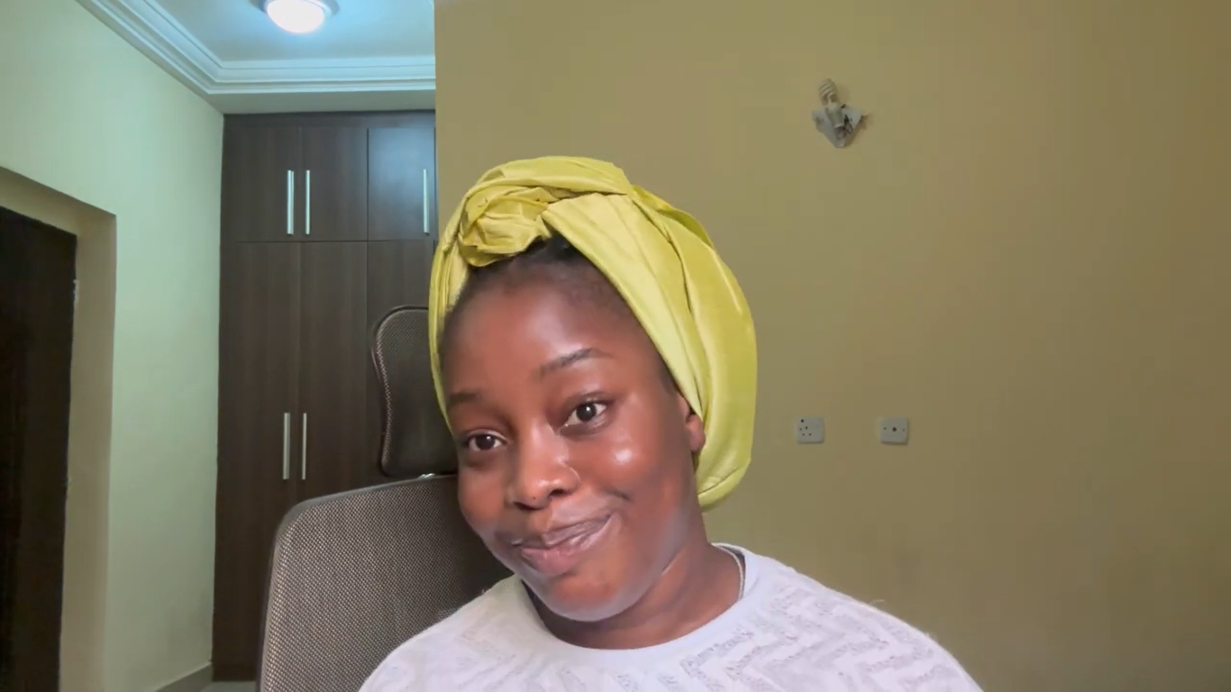 Treasure wearing a yellow headwrap