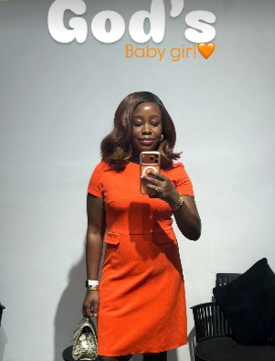 Treasure in a bright orange dress