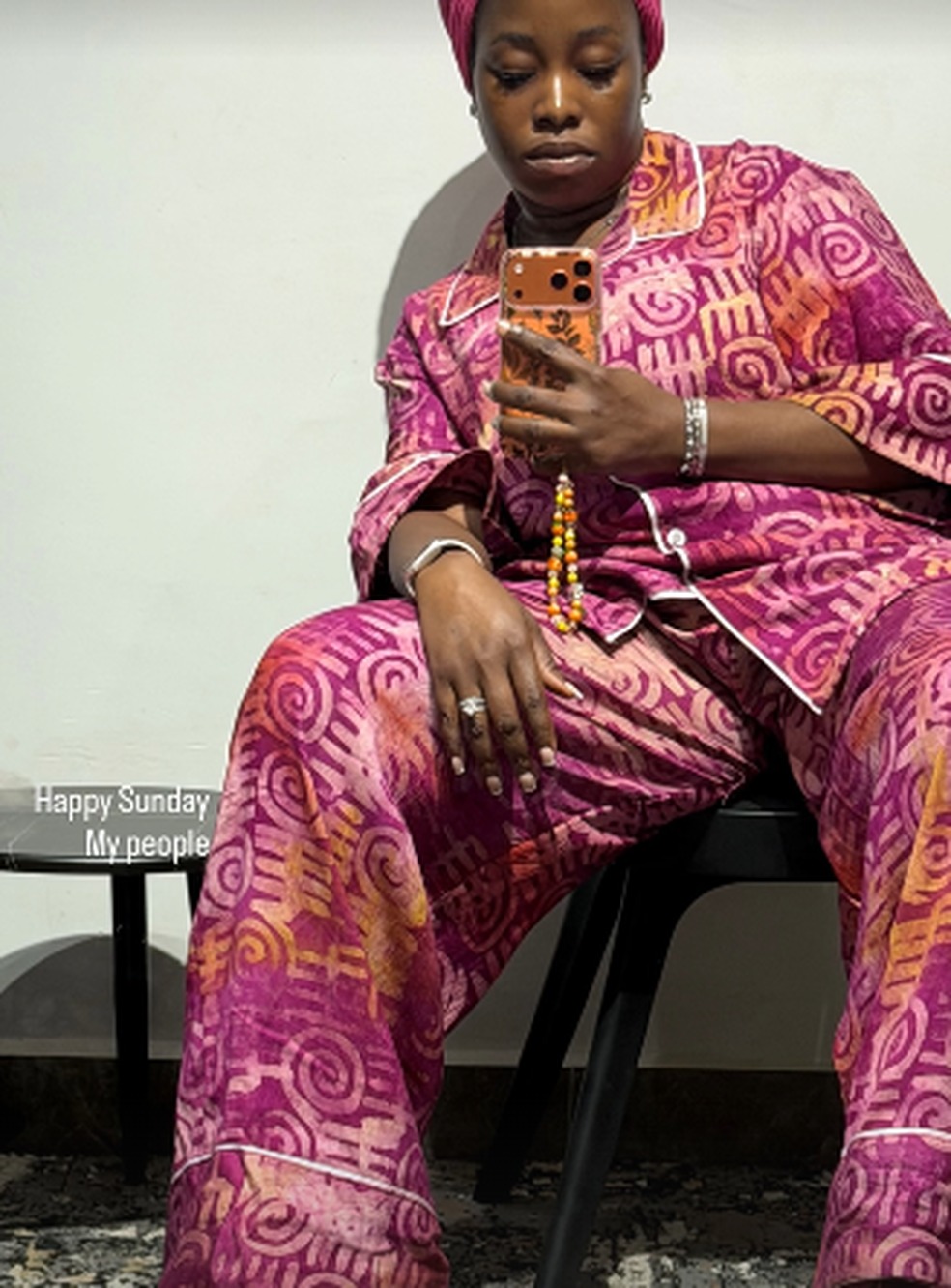 Treasure in a pink and orange print outfit