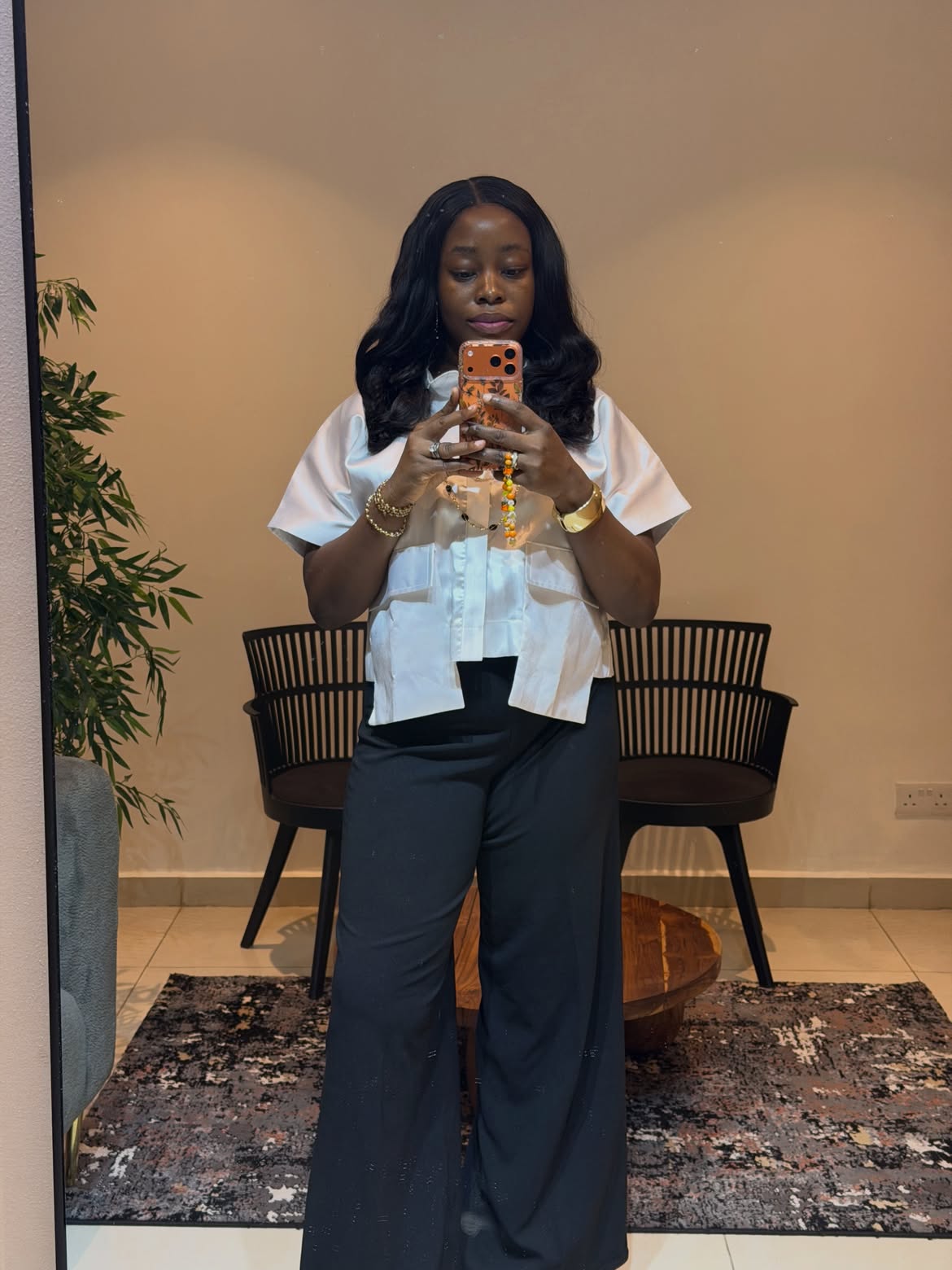 Treasure Oluwafunke A. taking a mirror selfie